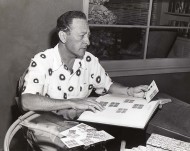 With his stamp collection With his stamp collection